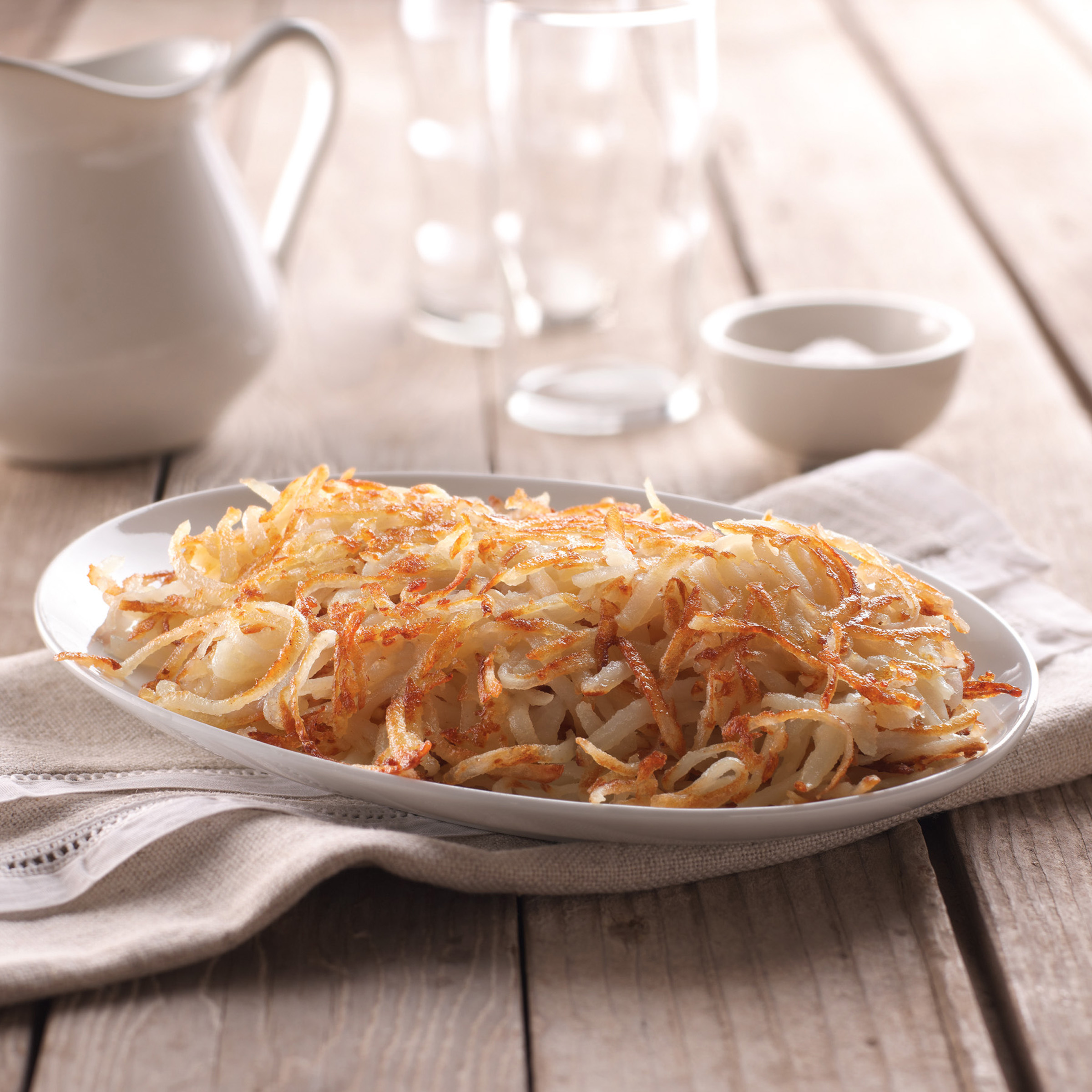 Simply Potatoes® Refrigerated Shredded Hash Browns made with peeled Russet potatoes, shredded 3/16
